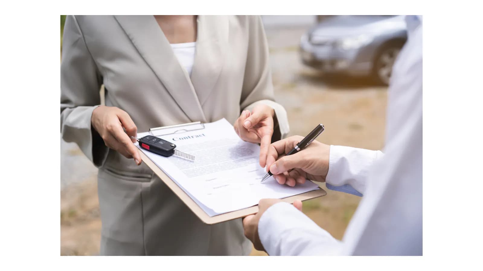 Oregon vehicle seller comparing identification with the owner name printed on a car title